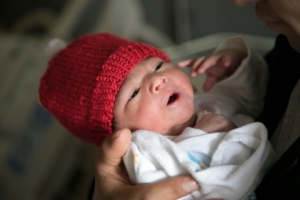 baby wearing red hat